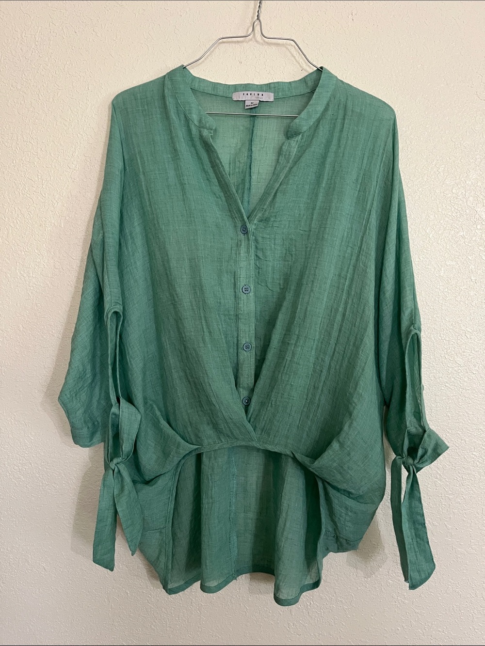 Favlux size medium bright sage green high-lo top.